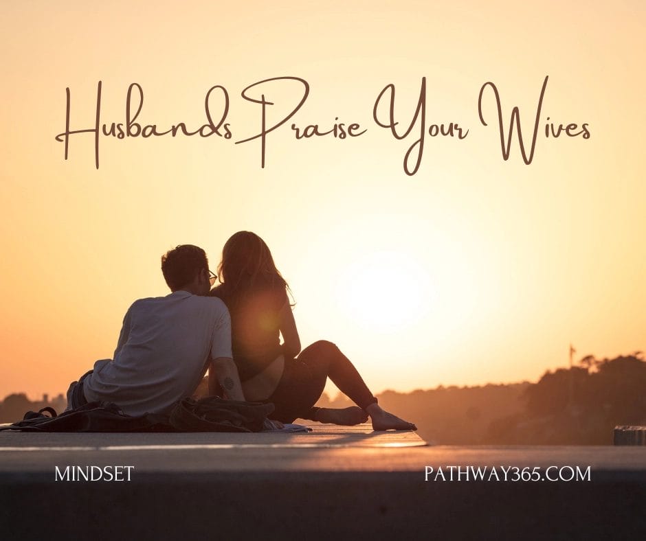 A husband and wife sitting together at sunset, silhouetted against warm light. Text reads: ‘Husbands Praise Your Wives,’ symbolizing honor and appreciation in marriage.”