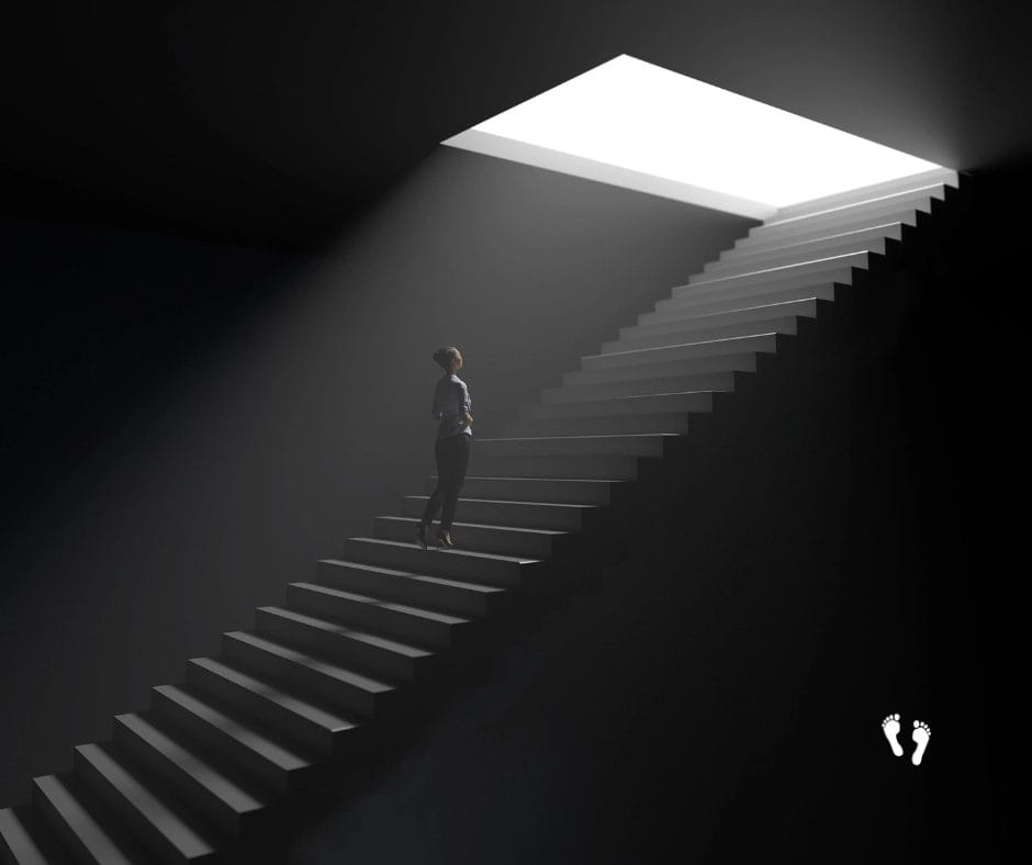 a woman walking up stairs