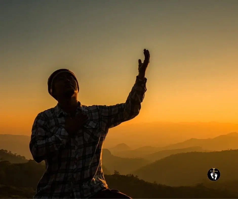 Man praying at sunrise with hands raised, symbolizing a husband seeking God’s guidance in marriage