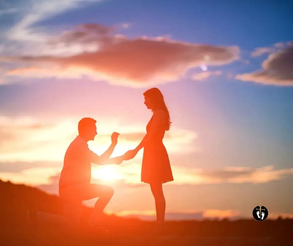 Silhouette of a man proposing at sunset symbolizing love, commitment, and biblical marriage