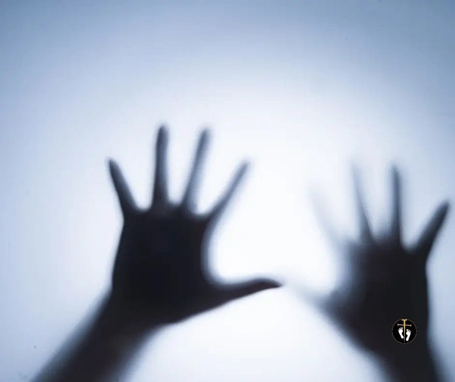 Person standing behind a blurred surface symbolizing anxiety, fear, stress, and emotional struggle in the Anxiety Bible Quiz.